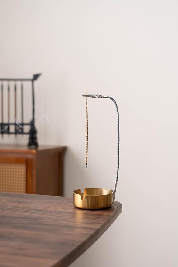 Modern Incense Holder with Flexible Metal Stand, Silver Ash Collector Base, Minimalist Design for Home Meditation and Aromatherapy.