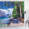 Ambesonne Landscape Shower Curtain, Scenic Lago di Garda Malcesine Italy Stone Bicycle Road with Flowers Lake, Cloth Fabric Bathroom Decor Set with Hooks, 69" W x 84" L, Green and Blue